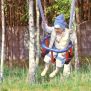 Kid swinging on Wooden Baby Swing