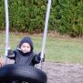 Little kid swinging on 1+2 Swing