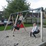 Kids swinging on 1+2 Swing