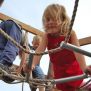 Little girl climbs on Sherwood